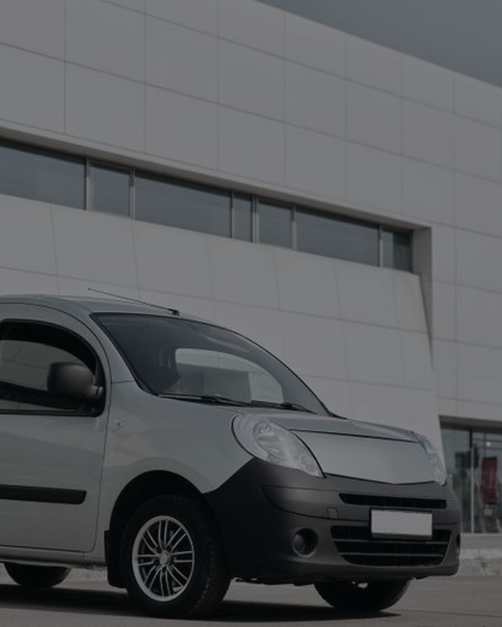 A cargo van parked at a loading bay